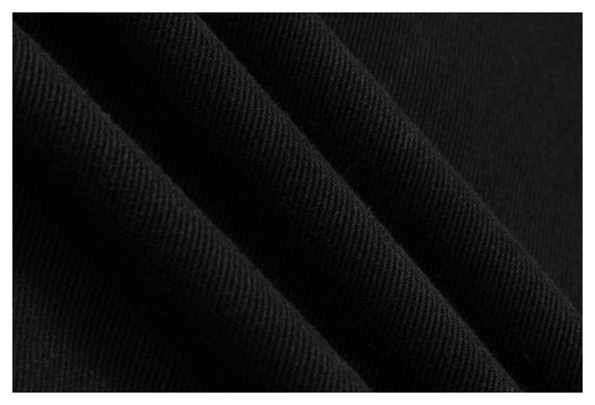 Extreme close-up showing the diagonal ridged texture of black fabric.