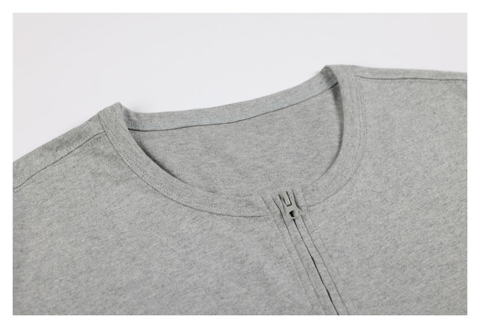 Close-up of a heather gray shirt's crew neckline and short front zipper.