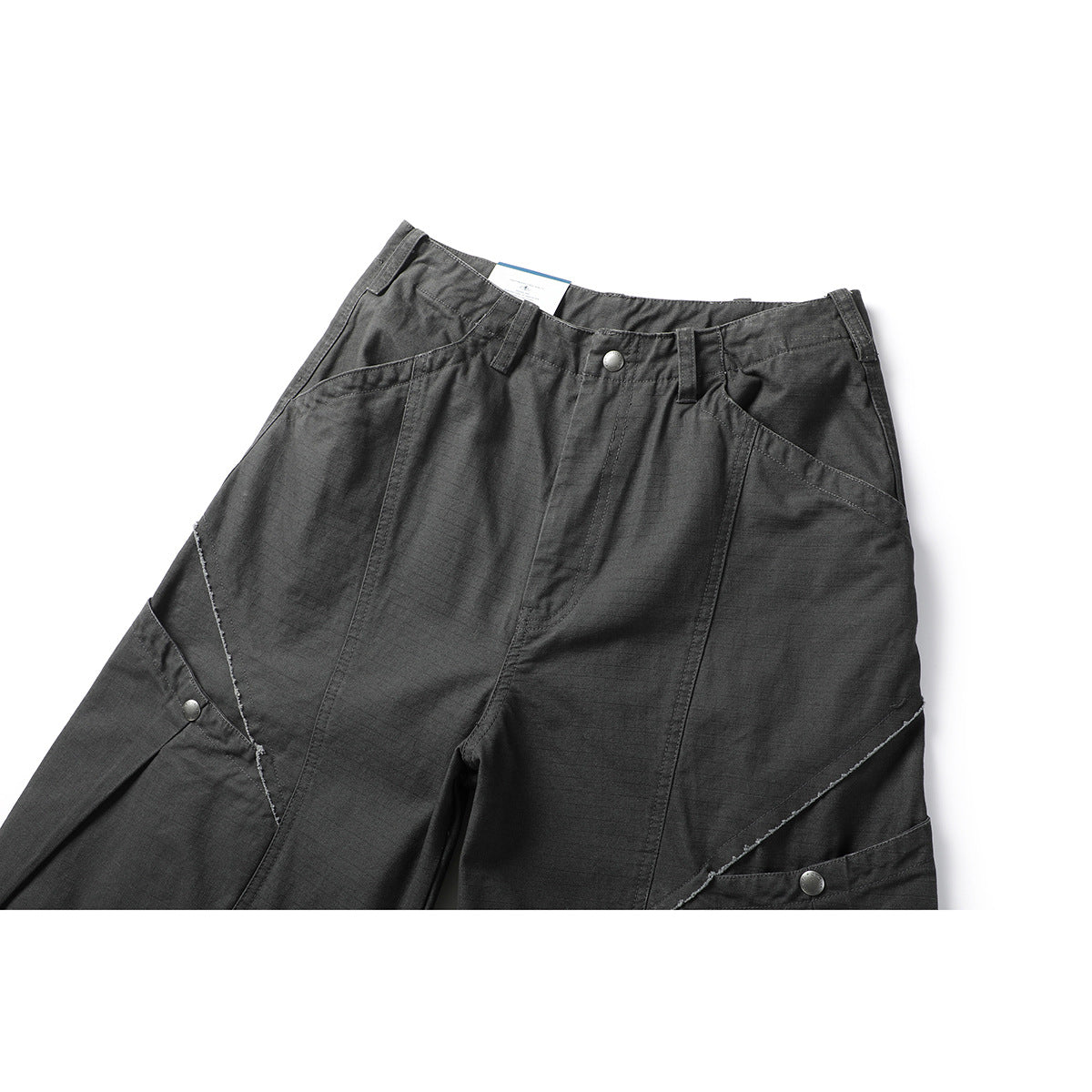 Close front view of charcoal-gray utility pants with angled leg panels, snap buttons, belt loops, and front pockets.
