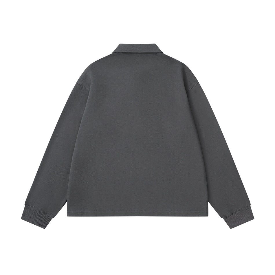 Back view of a dark charcoal long-sleeve collared pullover with ribbed cuffs.