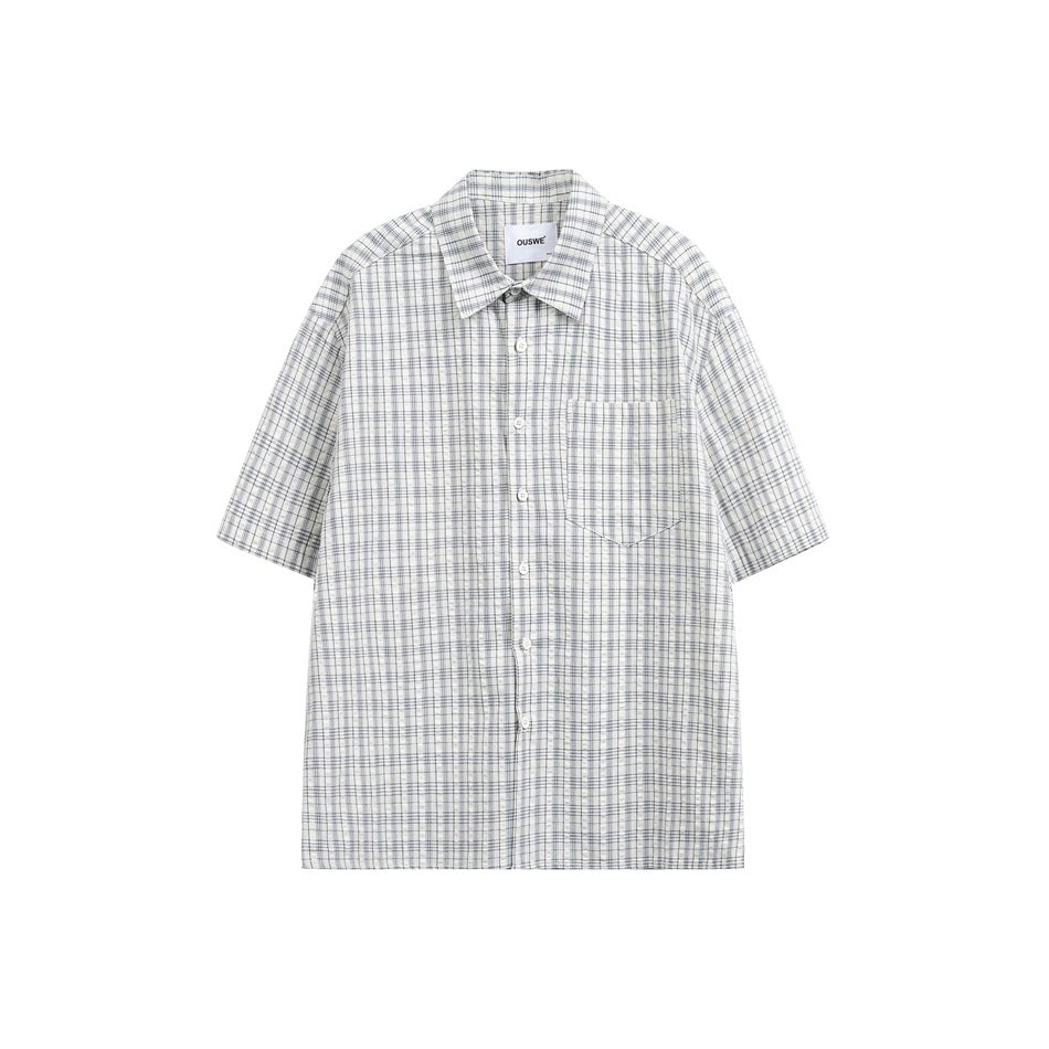 White and blue plaid short-sleeve button-up shirt with chest pocket, flat front view