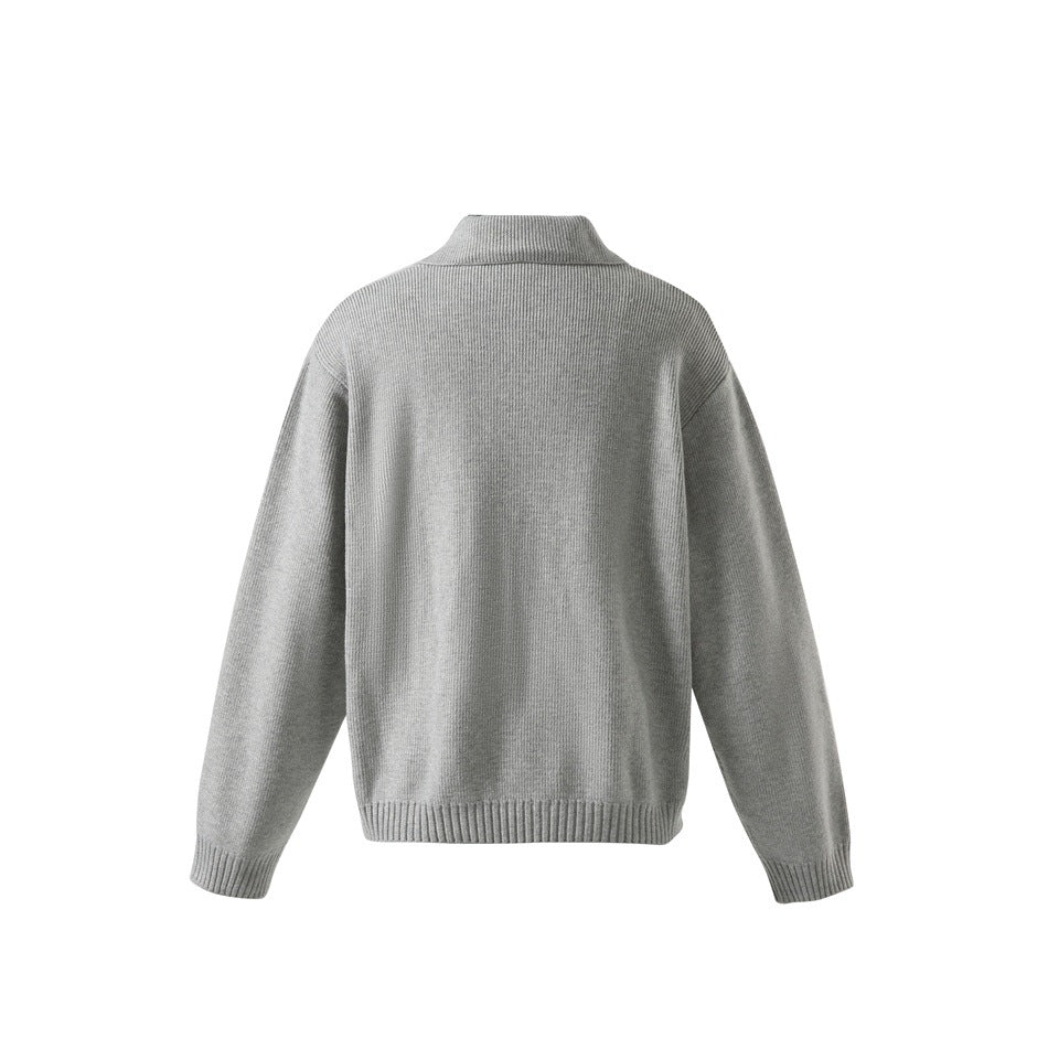 Back view of a light gray ribbed knit pullover sweater with a folded collar and ribbed cuffs and hem