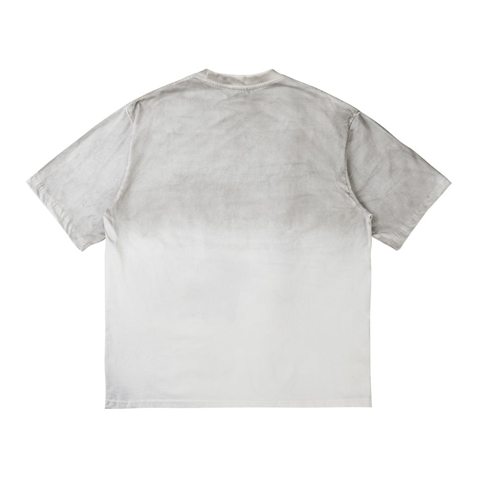 Back of an off-white short-sleeve T-shirt with a plain back and a gray gradient wash across the shoulders