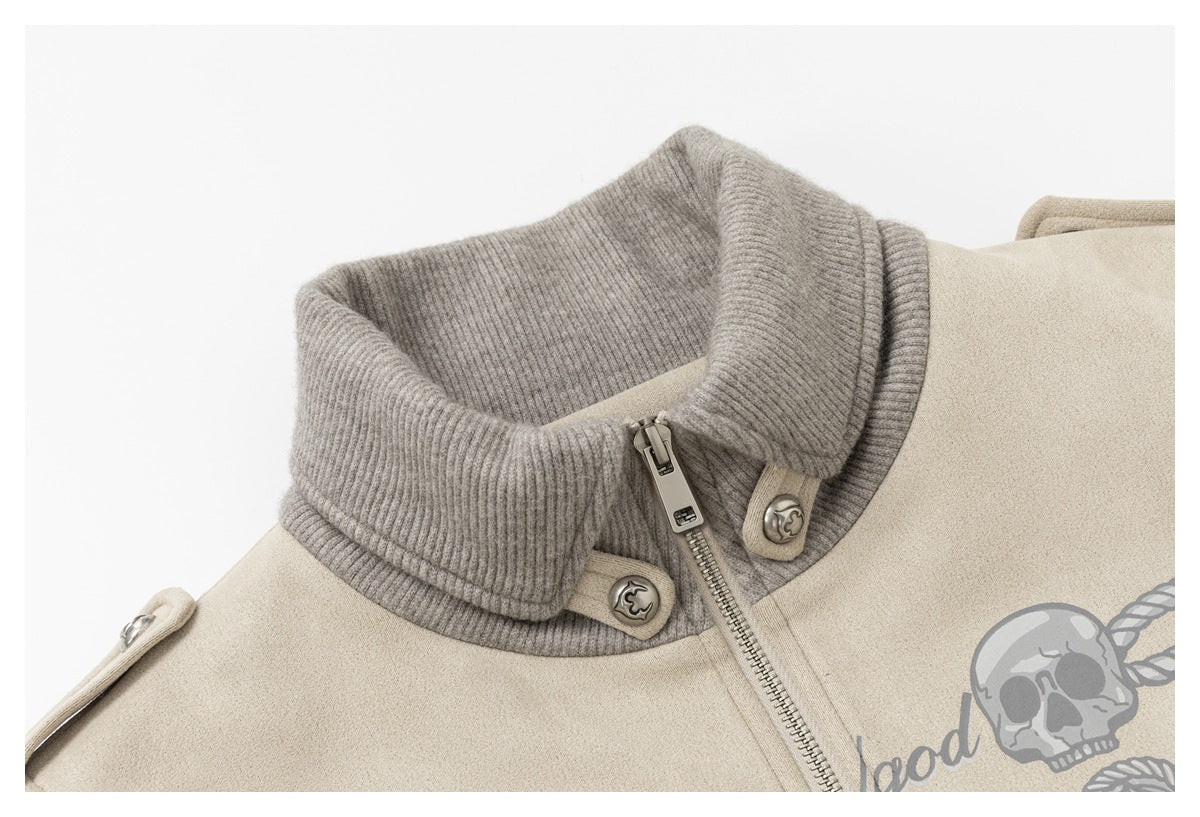 Close-up of the jacket's gray ribbed collar, metal zipper and buttons, with part of a skull graphic visible.