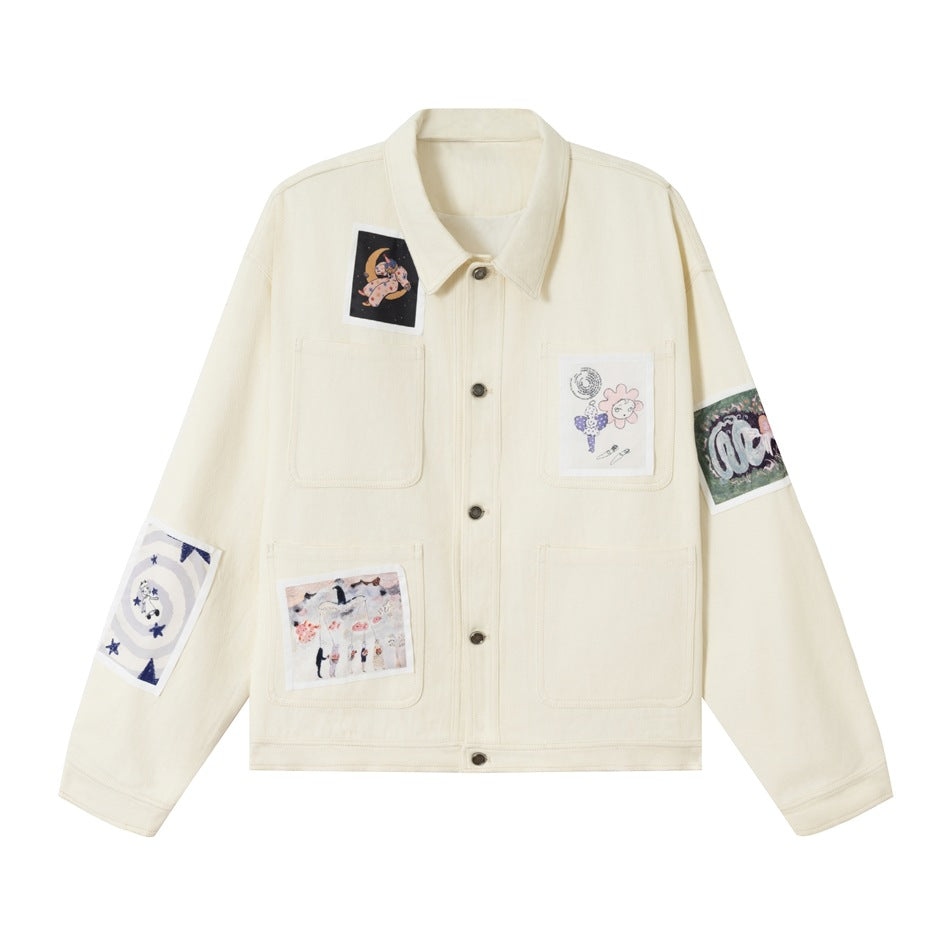 Beige work-style jacket with collar, button front, four patch pockets and illustrated fabric patches, flat front view