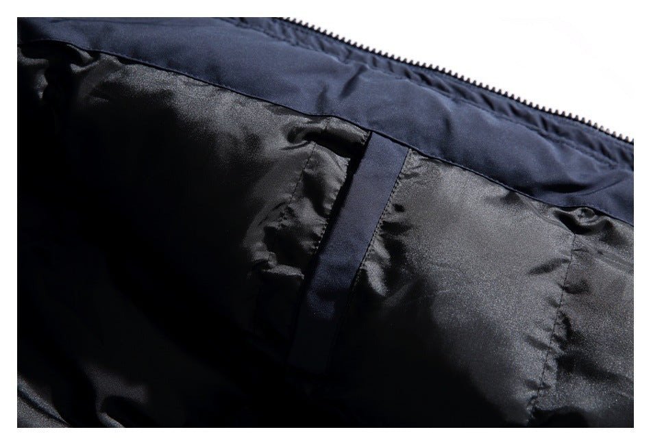 Close-up of black lining and an interior pocket on a dark navy garment.