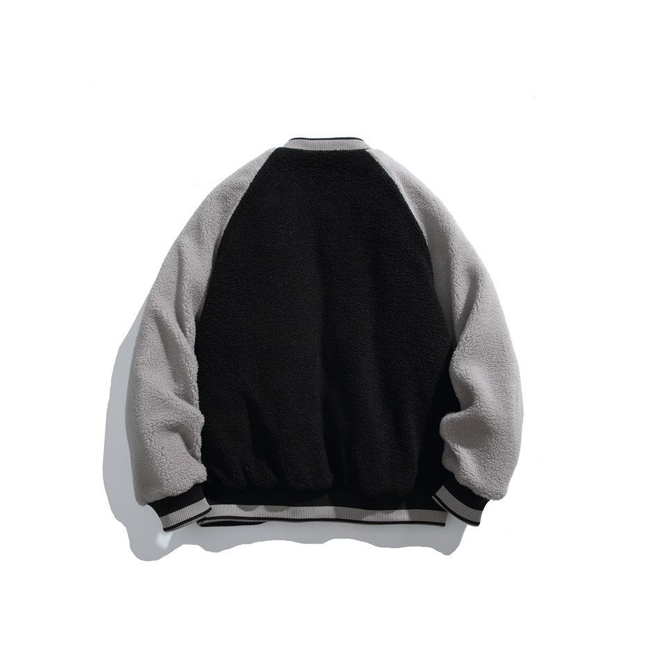 Back view of a jacket with a black body, gray sleeves and striped ribbed cuffs and hem.