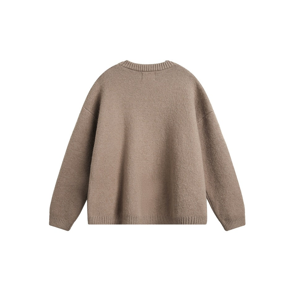 Back view of a plain taupe crewneck sweater with long sleeves and ribbed neckline, cuffs, and hem.