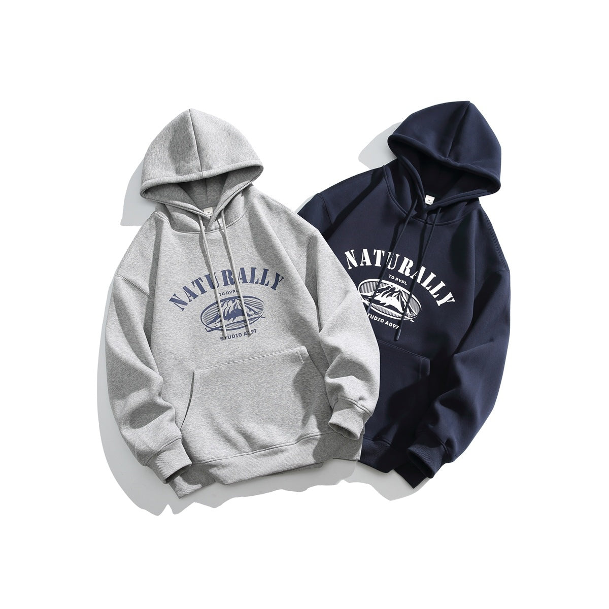 Two pullover hoodies laid flat: one heather gray and one navy, both with front mountain graphics and kangaroo pockets.