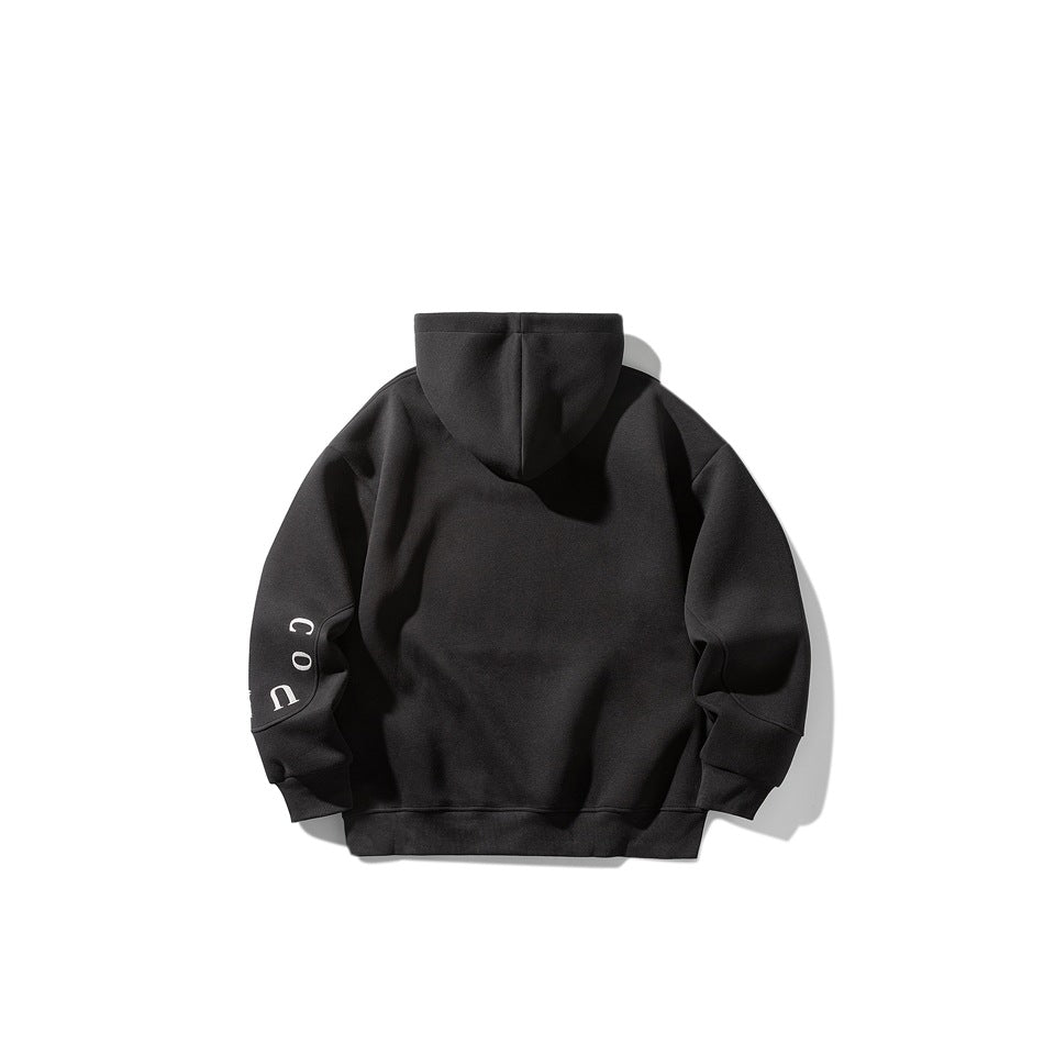 Back view of a black hooded sweatshirt with white lettering on one sleeve.