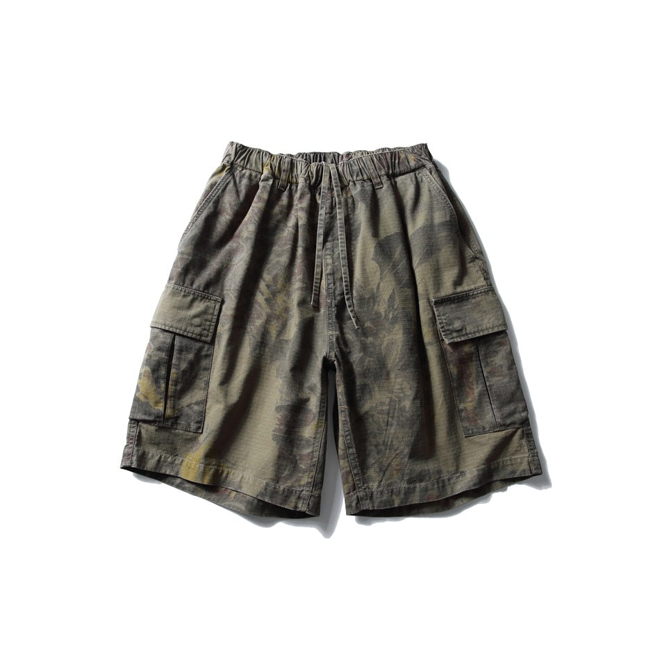 Olive-brown printed cargo shorts with elastic drawstring waist and flap thigh pockets, flat front view