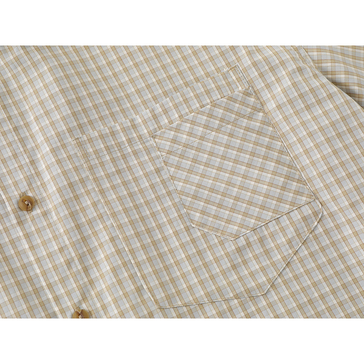 Close-up of the shirt's matching checked chest pocket and tan buttons.