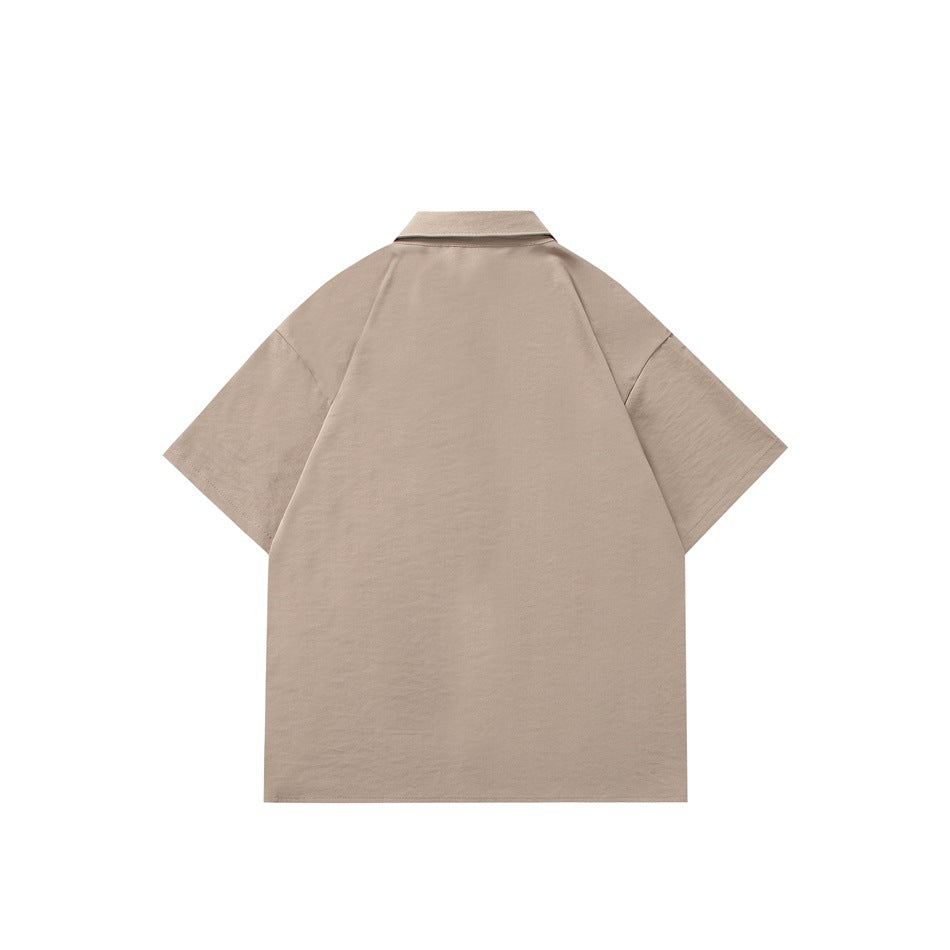 Back view of a taupe short-sleeve collared shirt with a straight hem.