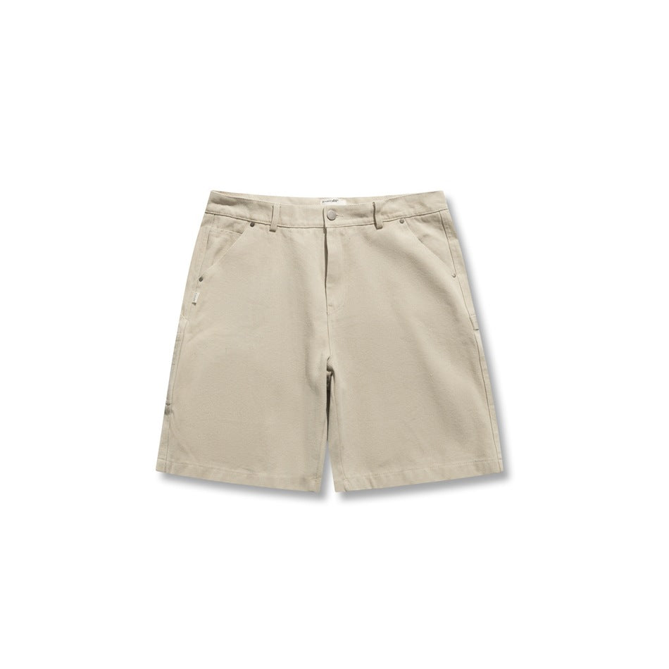 Front view of light khaki carpenter shorts with belt loops, button closure and rivet-trimmed pockets