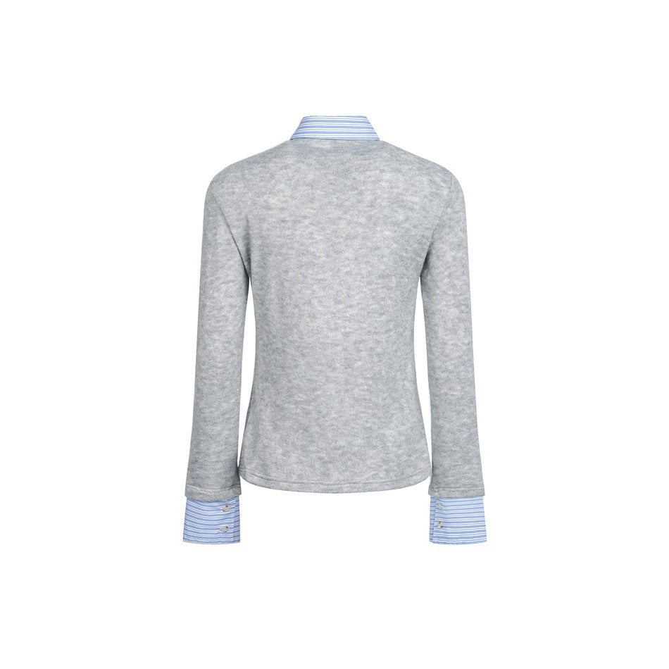 Back view of a gray long-sleeve sweater with a blue-and-white striped shirt collar and cuffs showing.