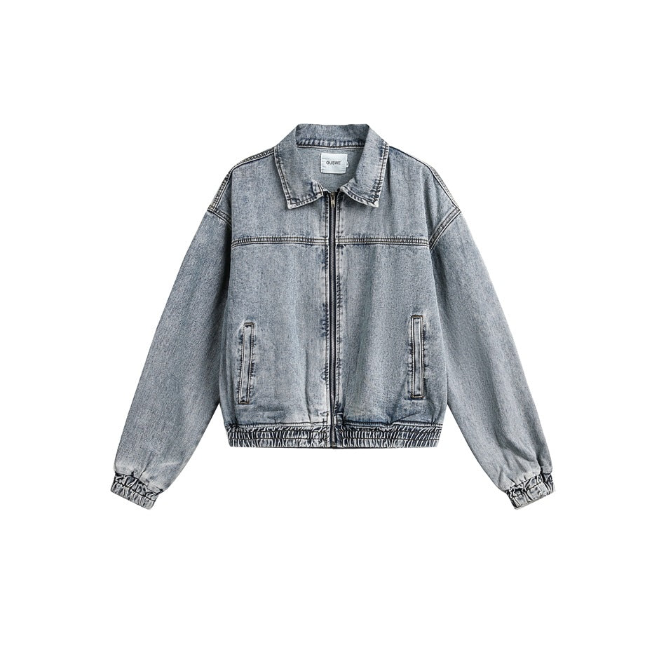 Light blue washed denim zip jacket with collar, slit pockets and elastic cuffs and hem, flat front view