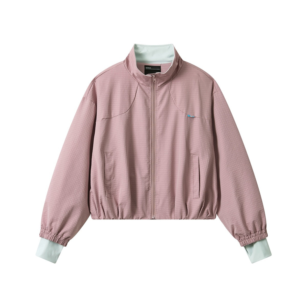 Pink textured zip-up cropped jacket with stand collar, mint contrast collar lining and cuffs, front view