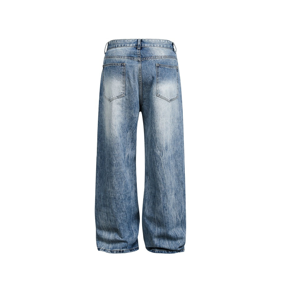Back view of faded light-blue wide-leg jeans with two patch pockets and wide legs on a white background.