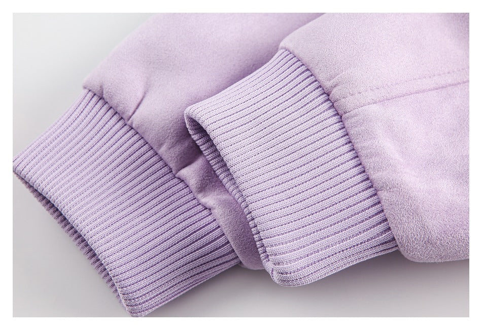 Close-up of two lavender ribbed cuffs attached to soft, smooth garment fabric.