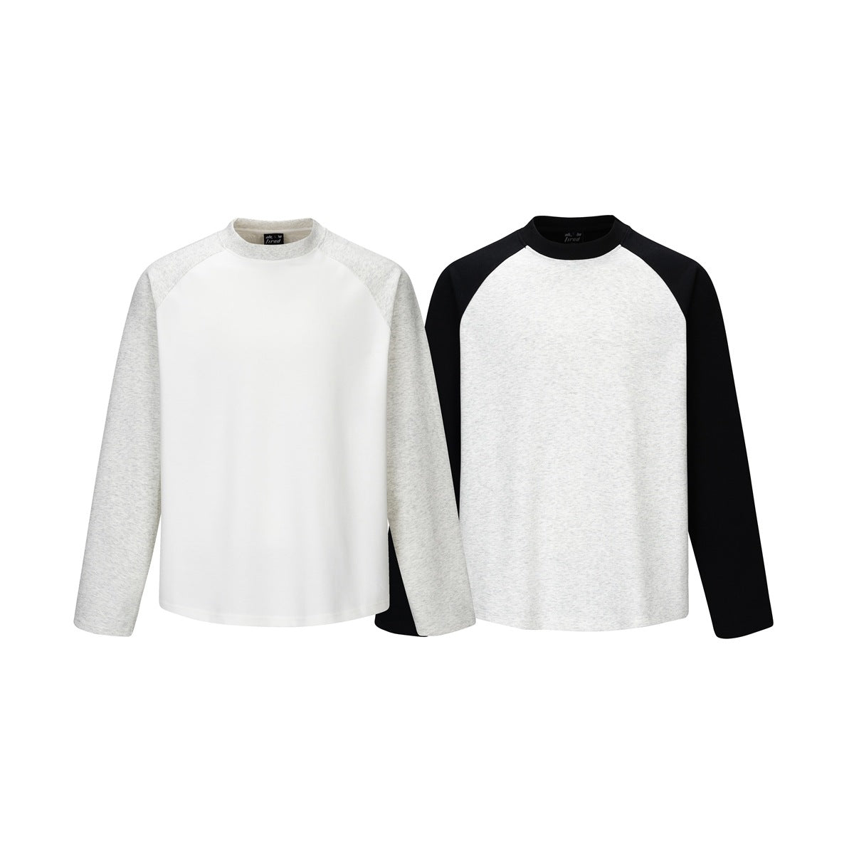 Front views of two long-sleeve raglan shirts: white with heather gray sleeves, and heather gray with black sleeves.