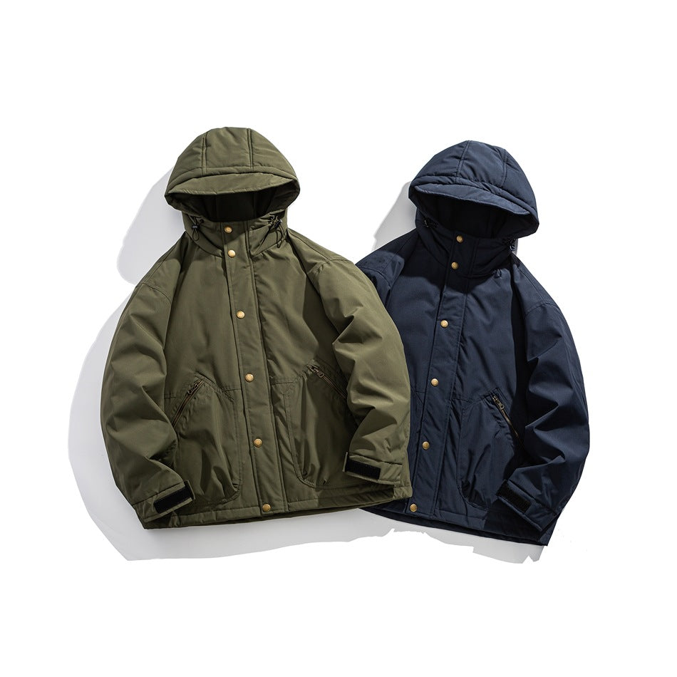 Two hooded jackets displayed together in olive green and dark navy, each with brass-tone snaps and zippered pockets.