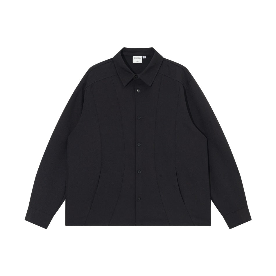 Black long-sleeve button-front shirt with pointed collar and curved panel seams, flat lay front view