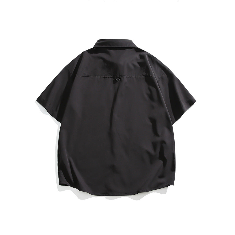 Back view of a black short-sleeve button-up shirt with a spread collar and curved hem.