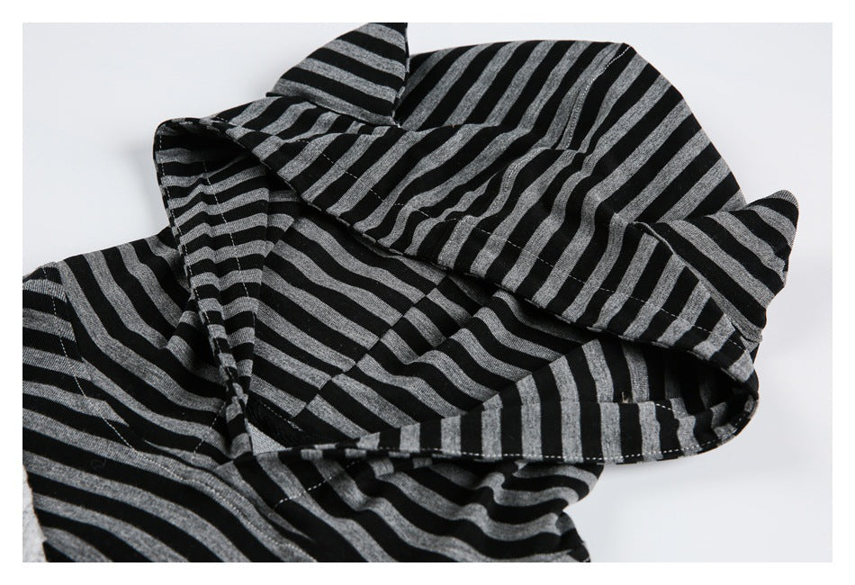 Close-up of the black-and-gray striped hood, showing its shape, seams, and fabric.