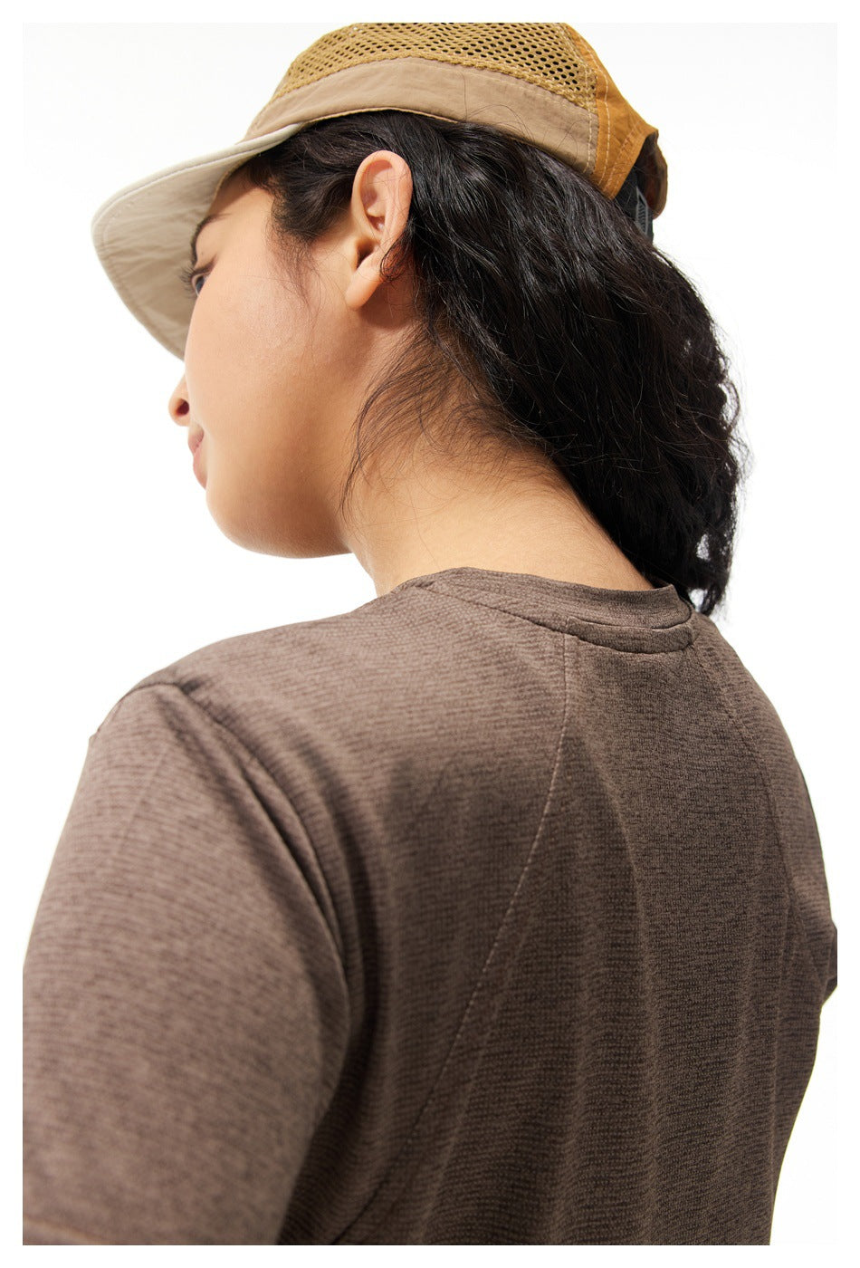 Close-up of the brown shirt's back shoulder, collar, and panel stitching.