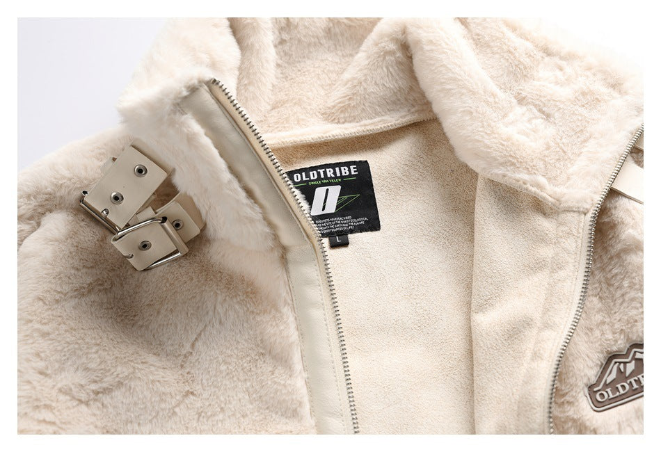 Inside view of an ivory faux-fur jacket showing its zipper, buckle hardware, and OLDTRIBE label.