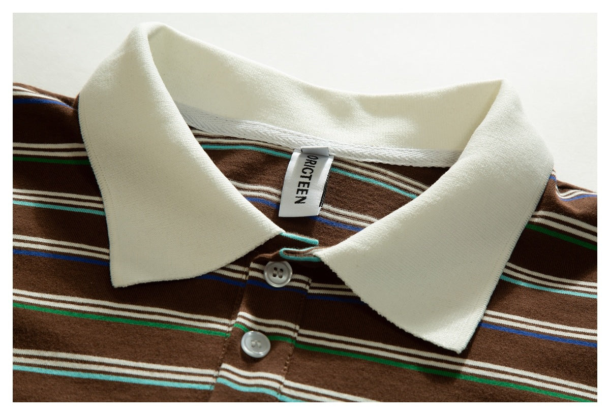 Close-up of the cream collar and button placket on a brown striped polo shirt, with its neck label visible.