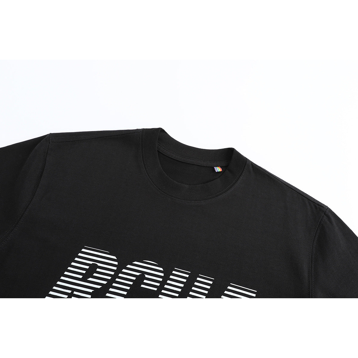 Close-up of a black crew-neck T-shirt with part of a white striped chest graphic.