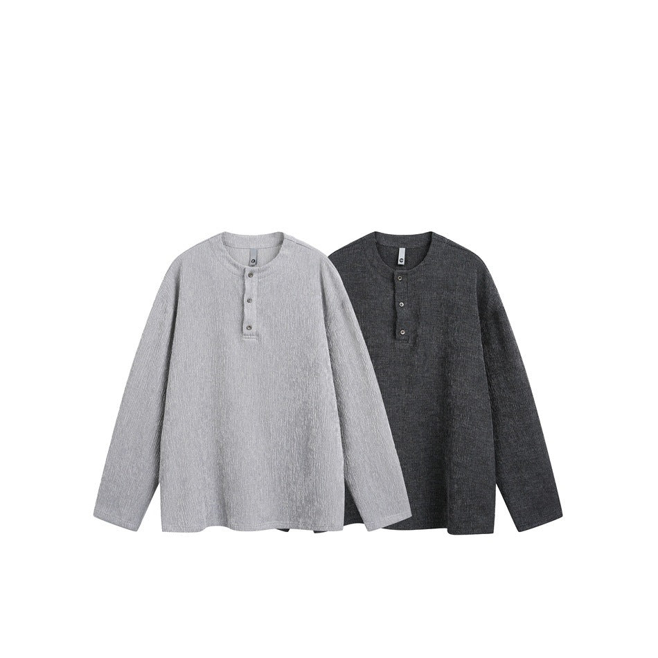 Two long-sleeve henley tops displayed side by side in light gray and charcoal, front view.