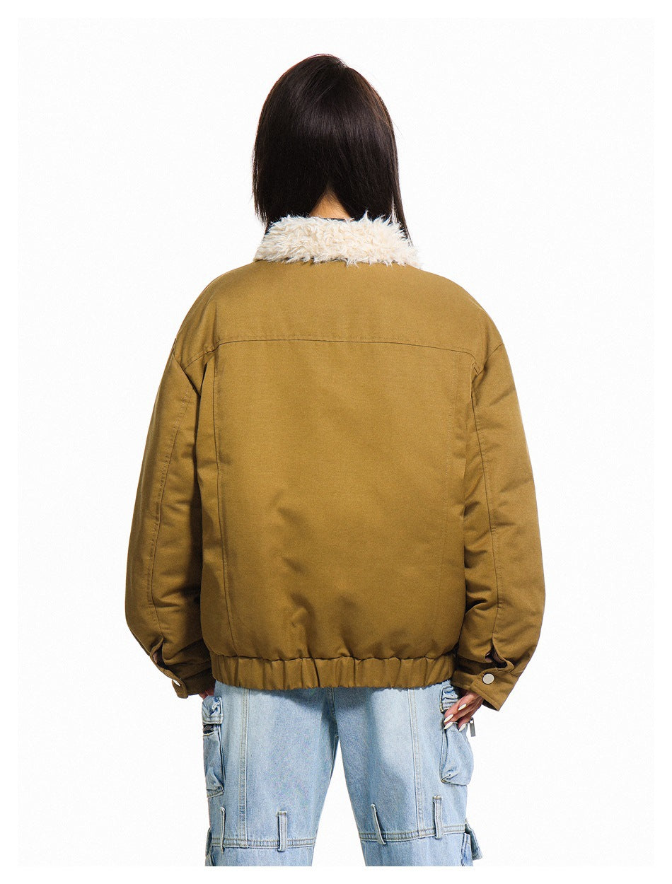 Back view of a model wearing a mustard-brown jacket with a cream fleece collar and gathered hem.