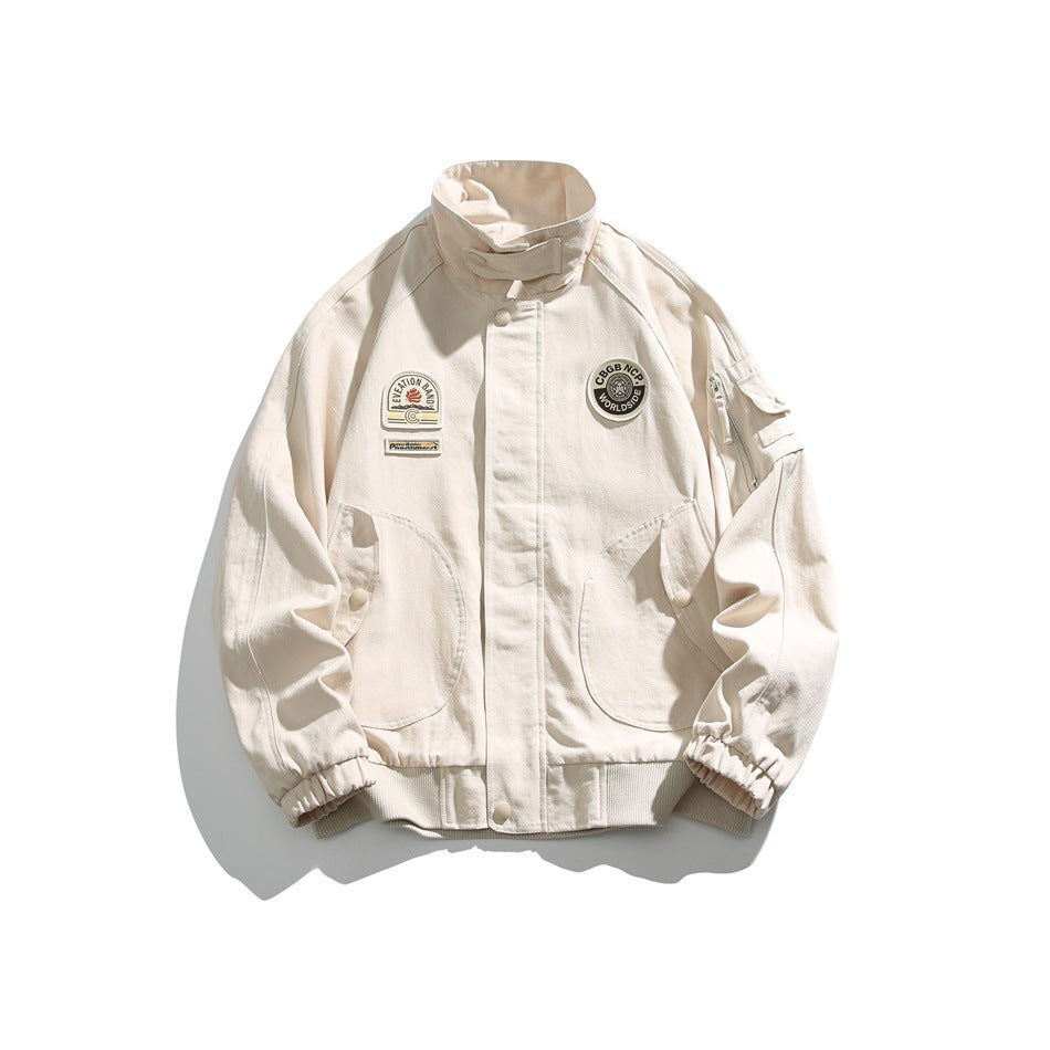 Off-white bomber-style jacket with stand collar, chest patches, curved front pockets, sleeve zip pocket and ribbed hem