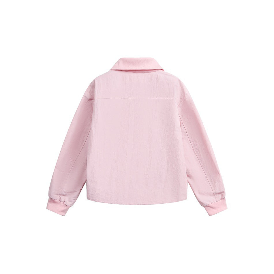 Back view of a pale pink jacket with a wide collar, long sleeves, and ribbed cuffs, shown flat against a white background.