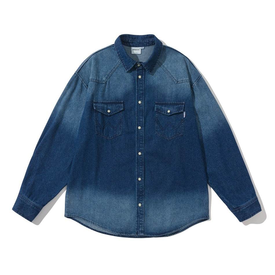 Blue faded-wash denim shirt with snap buttons and two flap chest pockets, flat front view