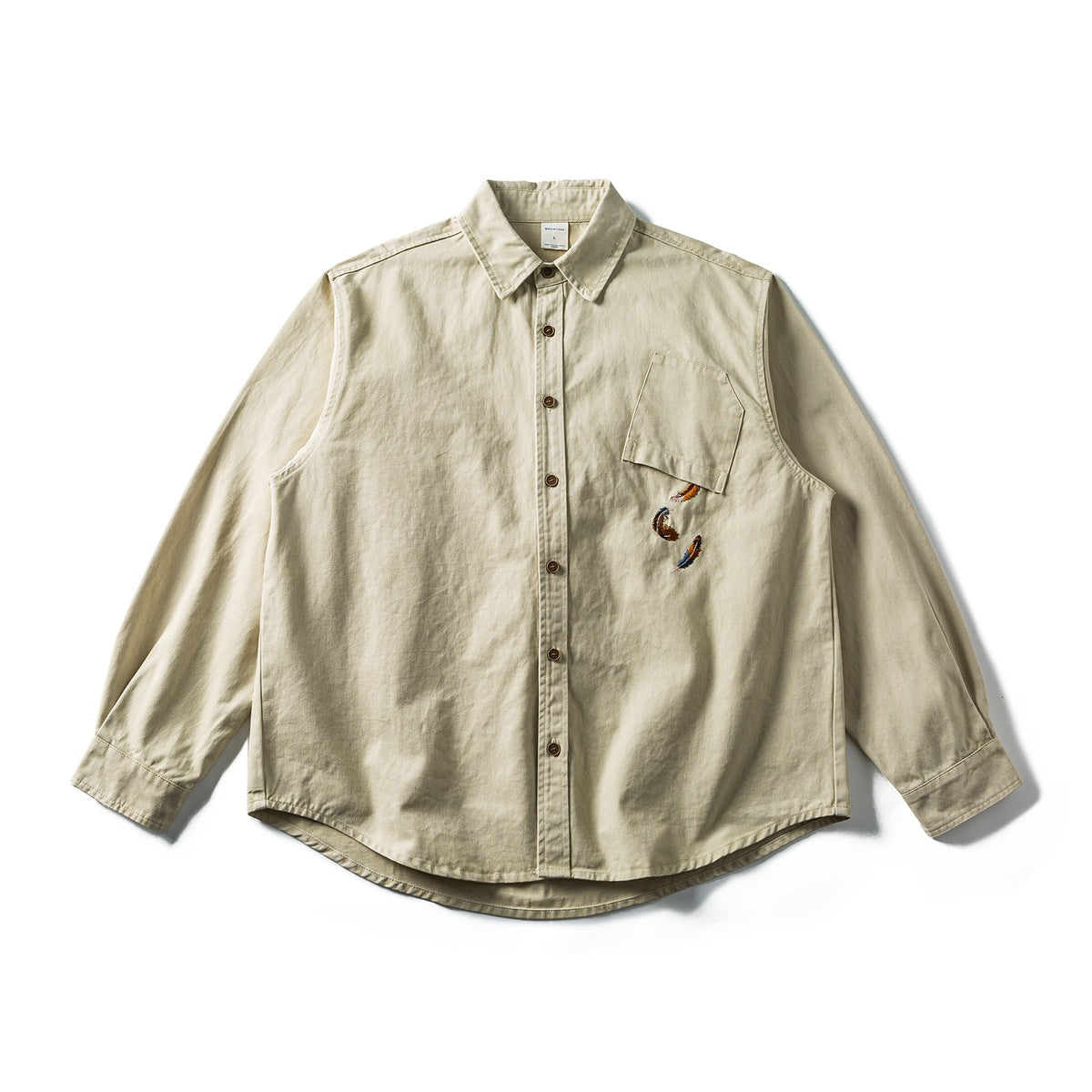 Khaki long-sleeve button-up shirt flat lay with brown buttons, chest pocket and embroidered feathers