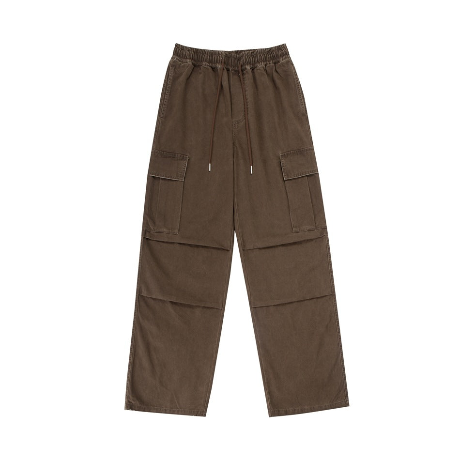 Coffee brown wide-leg cargo pants with drawstring waist, thigh flap pockets and knee pleats, flat front view