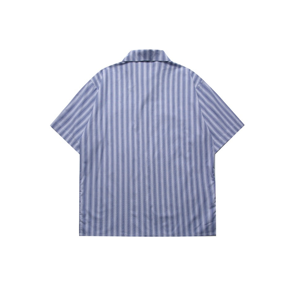 Back view of a blue and white vertical striped short-sleeve shirt laid flat