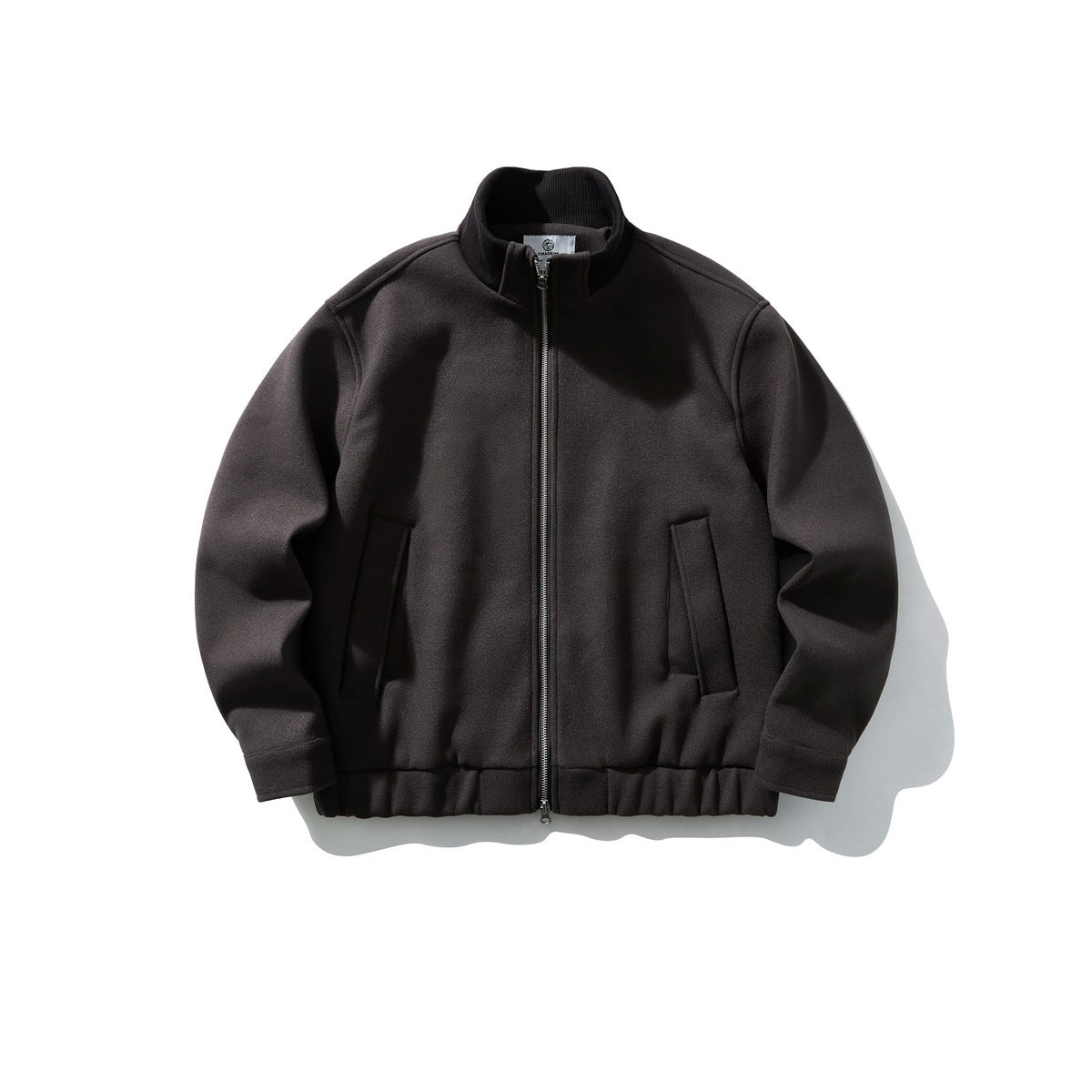 Dark brown stand-collar zip jacket with black ribbed collar, slanted pockets and elastic hem, flat lay