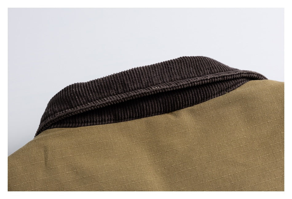 Close-up of a dark brown ribbed collar against an olive-brown garment.