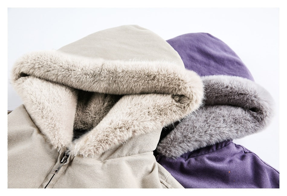Close-up of beige and purple jacket hoods showing thick gray fur trim and partially visible front zippers.