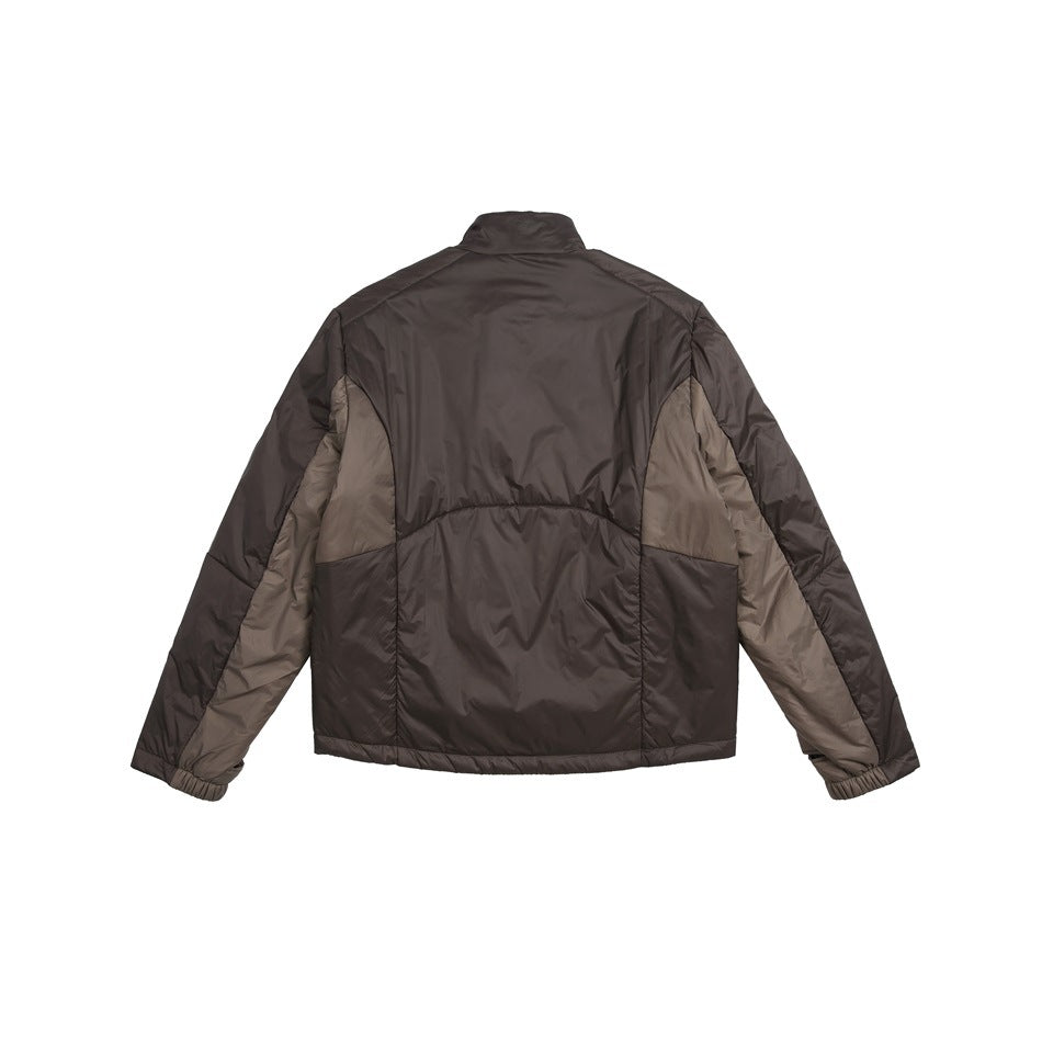 Rear view of a dark brown jacket with taupe side panels, a stand collar, and elastic cuffs.