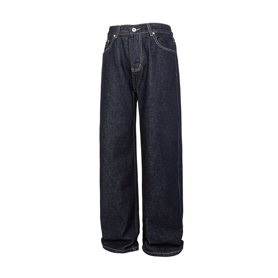Front view of dark indigo wide-leg jeans with a button closure, curved pockets, and tan stitching.