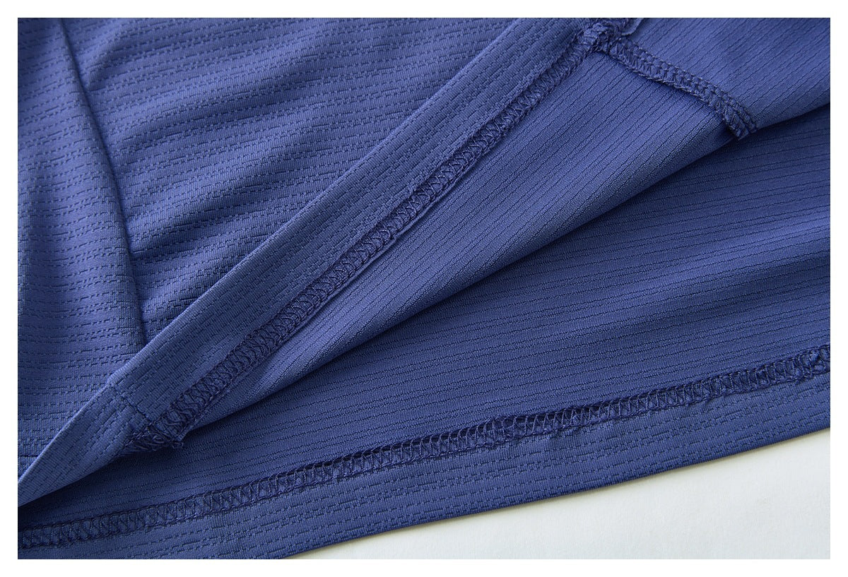Close-up of the blue shirt's interior seam and overlocked stitching.