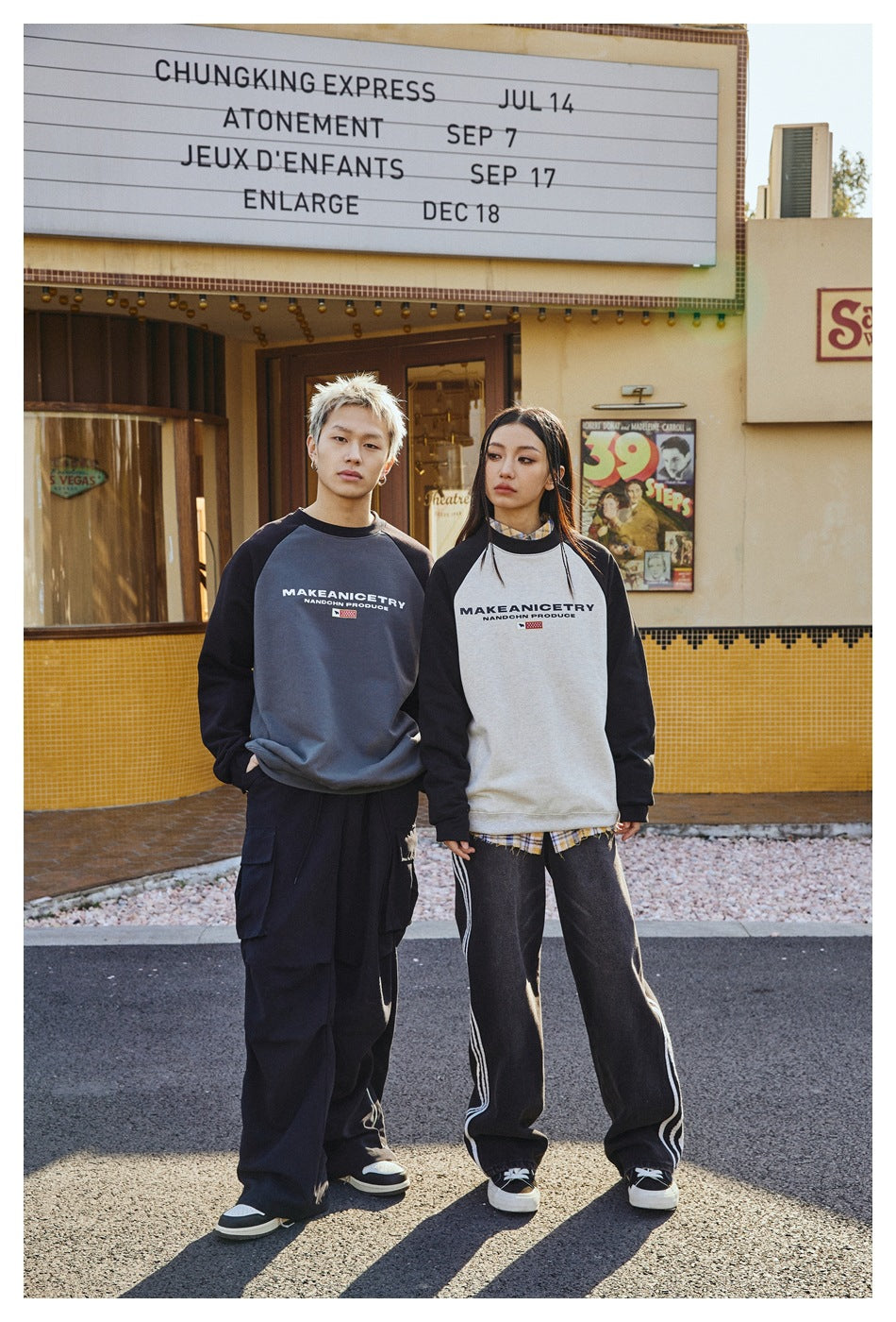 Two models show gray-and-black and white-and-black raglan sweatshirts from the front.