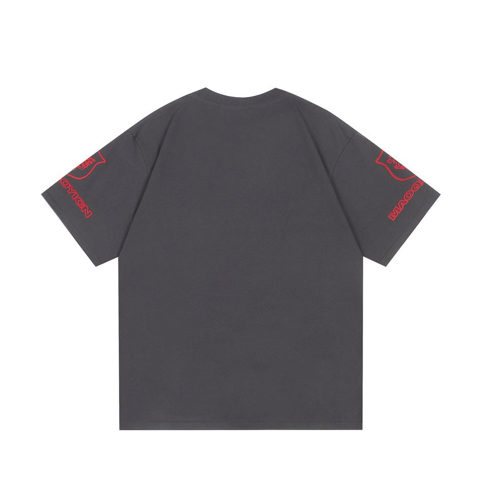 Back view of a charcoal gray short-sleeve shirt with red graphics on both sleeves.