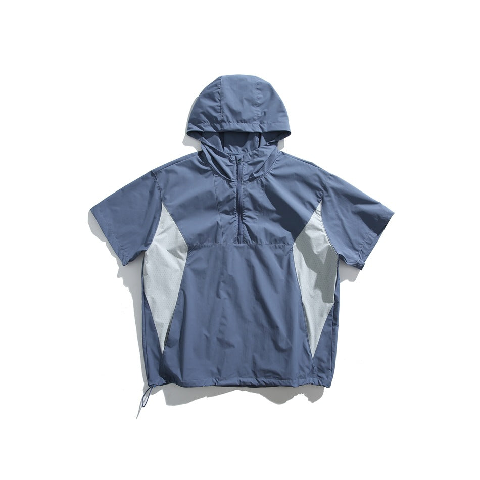 Blue short-sleeve hooded half-zip top with light gray side panels and drawcord hem, flat lay on white