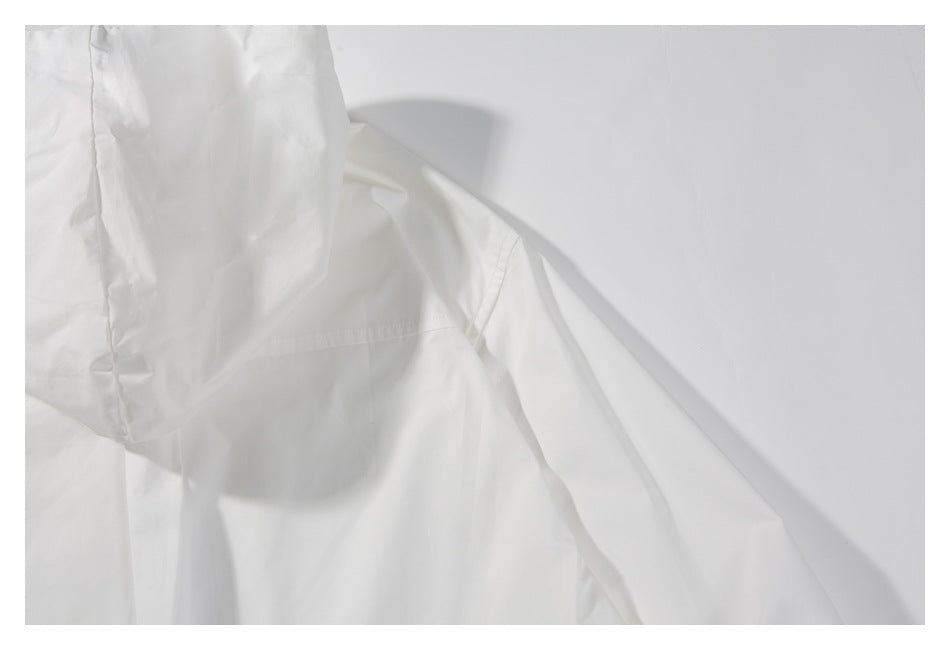 Close-up of the white garment's hood and shoulder seam.